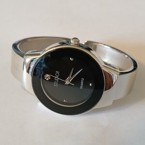Studio Time Women's Silver Tone Black Round Dial Quartz Spring Cuff Band Watch